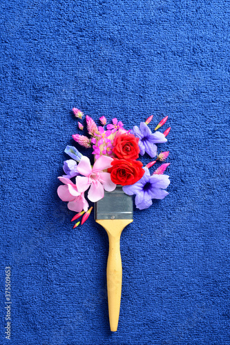 A flay lay of artistic brush with flowers