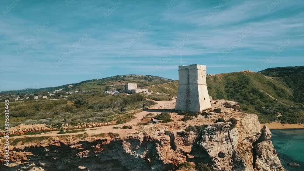Għajn Tuffieħa Tower from the side by drone on the sunny day. Malta Island Għajn Tuffieħa Tower from the side by drone on the sunny day. Malta Island