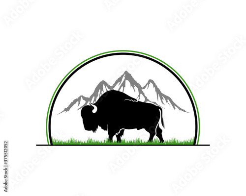 Bull silhouette with mountain scene the behind