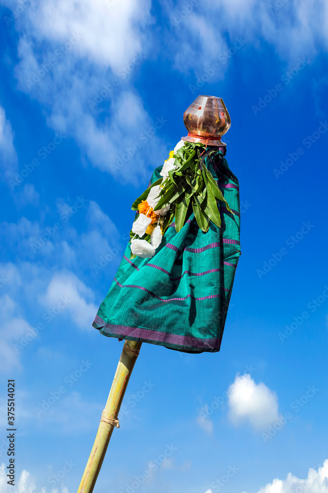 Fototapeta premium As per Hindu culture, hosted `Gudhi` on clear background of gorgeous blue sky.