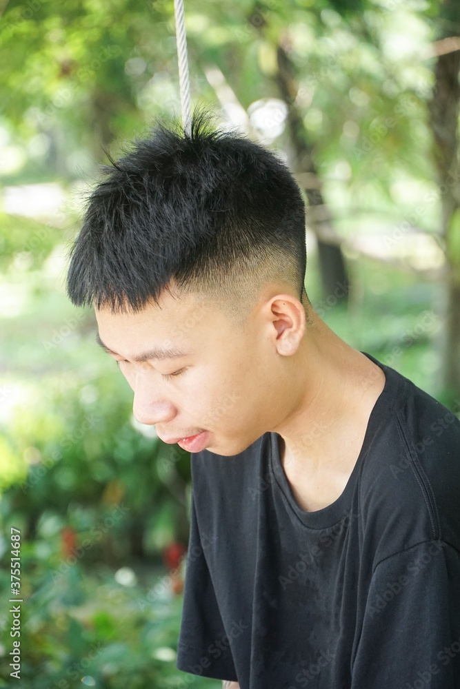 close up young man in nature garden close up young man in nature garden