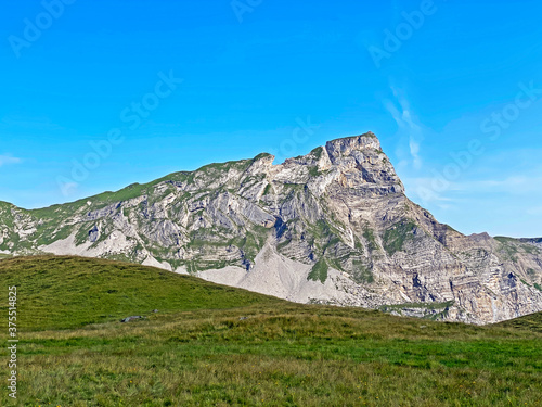 Alpine peaks Chli Haupt Murmelchopf and Haupt or Brünighaupt (Bruenighaupt oder Brunighaupt) in the Uri Alps mountain massif, Melchtal - Canton of Obwald, Switzerland (Kanton Obwalden, Schweiz) photo