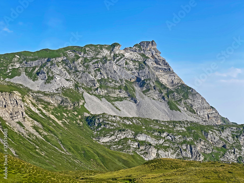 Alpine peaks Chli Haupt Murmelchopf and Haupt or Brünighaupt (Bruenighaupt oder Brunighaupt) in the Uri Alps mountain massif, Melchtal - Canton of Obwald, Switzerland (Kanton Obwalden, Schweiz) photo