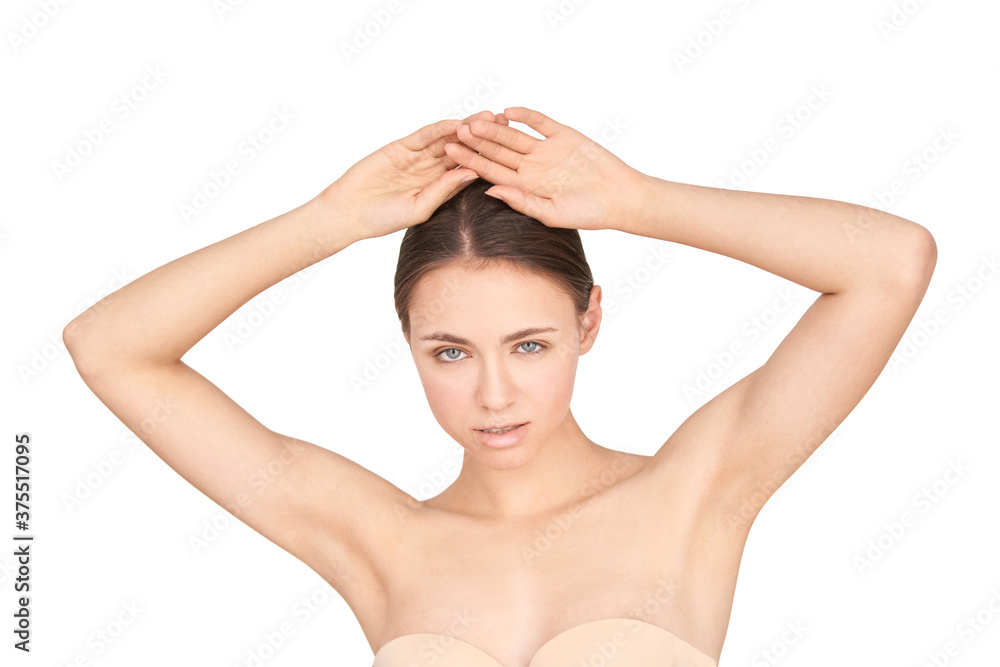Obraz premium Girl armpit. Clean skin. Hands up. Deodorant skincare. Without hair under arms. Pretty girl studio portrait. White isolated background. Depilation concept. Home routine