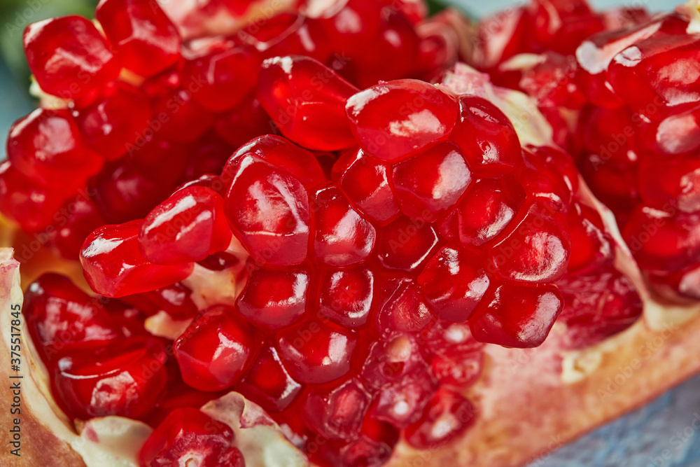 Rosh Hashanah - Jewish New Year holiday concept. Cut pomegranate, texture background Rosh Hashanah - Jewish New Year holiday concept. Cut pomegranate, texture background