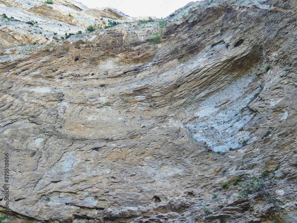 Photo of an imposing rock wall taken from the chasm of Fontaine de Vaucluse in Provence Photo of an imposing rock wall taken from the chasm of Fontaine de Vaucluse in Provence