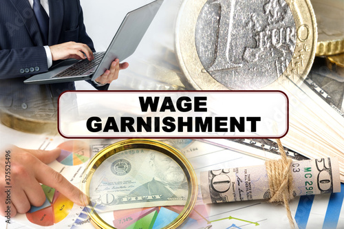 Photos A businessman holds a folder with documents, the text on the folder is - WAGE GA