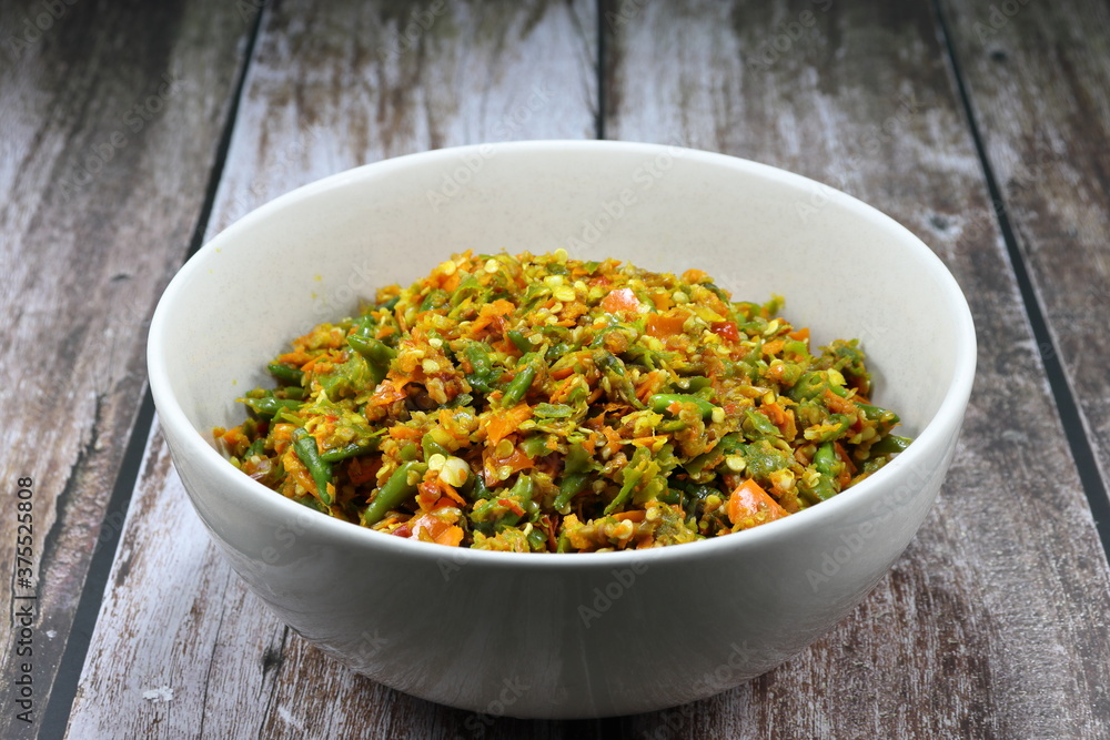 Cutting or chopped fresh Thai chilly on the bowl. Famous traditional spices ingredients in Asia restaurant. Preparation food concept. Cutting or chopped fresh Thai chilly on the bowl. Famous traditional spices ingredients in Asia restaurant. Preparation food concept.