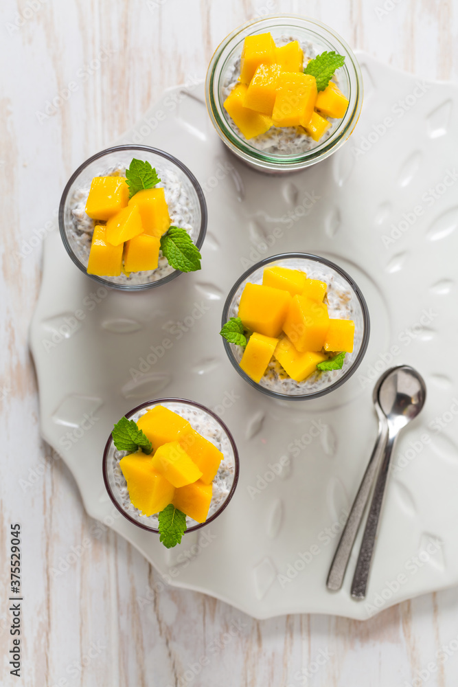 Chia seed pudding with yogurt, raspberry mousse and fresh mango Chia seed pudding with yogurt, raspberry mousse and fresh mango