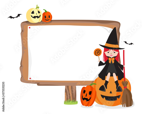 ハロウィンな魔女に扮した女の子と看板
