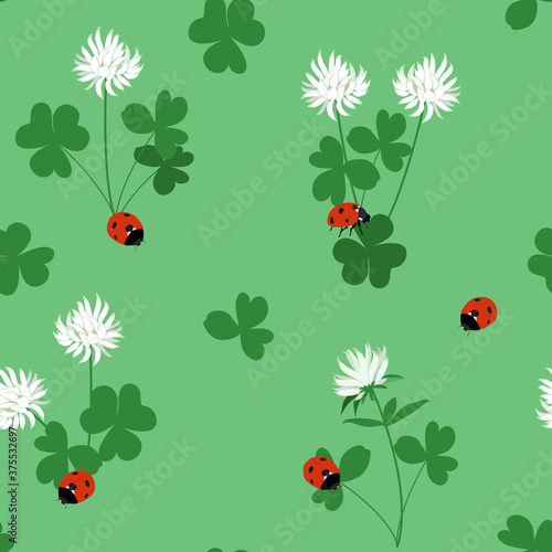 Seamless vector illustration with flowers, leaves of clover and ladybirds