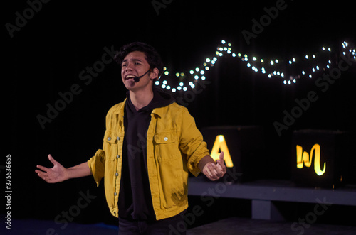 young actor latino in the theater stage