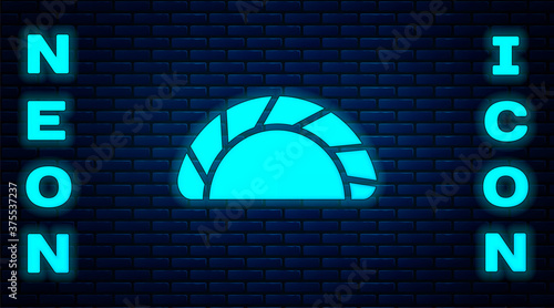 Glowing neon Dumpling icon isolated on brick wall background. Traditional chinese dish. Vector.