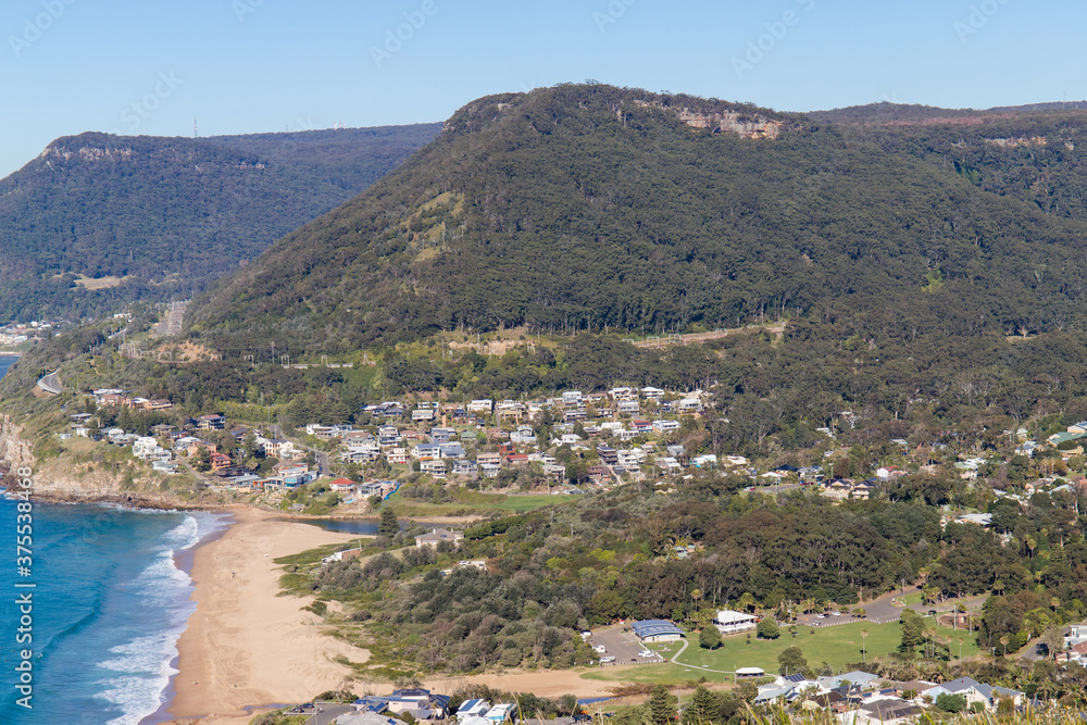 Buildings around hill and beach at Stanwell, Sydney, Australia.