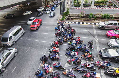 Chong nonsi, Bangkok, 16 April 2019, Motorcycles in traffic jam at the intersection. Group of Motorcycles jam in rush hour at the center of business district. Popular transports in modern city. photo