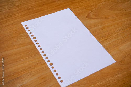 blank paper for mockup concept on wooden board. finance, education background