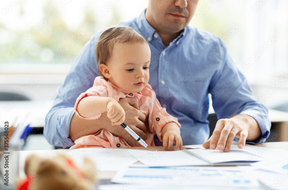 remote job, multi-tasking and family concept - middle-aged father with baby working at home office remote job, multi-tasking and family concept - middle-aged father with baby working at home office