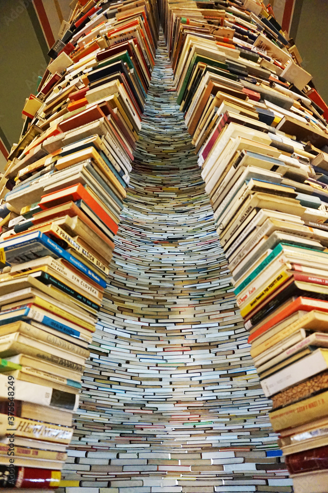 PRAGUE, CZECH REPUBLIC - 10 january, 2018: a endless book tunnel tower in Prague, in the public library PRAGUE, CZECH REPUBLIC - 10 january, 2018: a endless book tunnel tower in Prague, in the public library