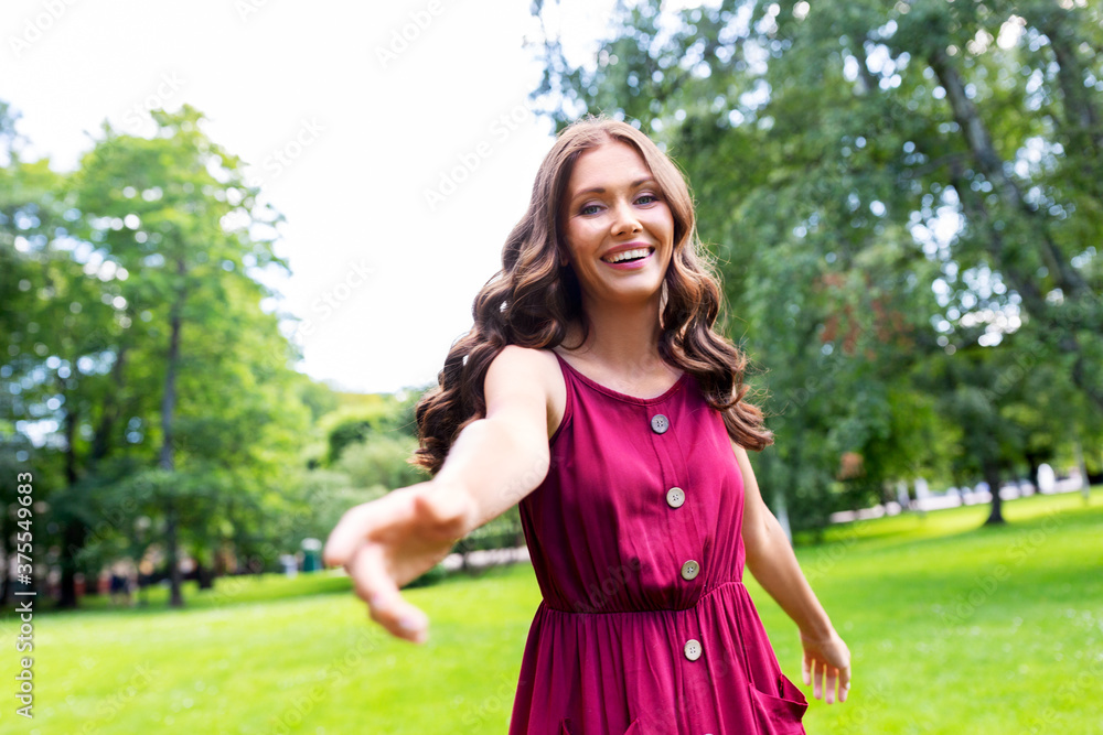 leisure and people concept - portrait of happy smiling beautiful woman with long wavy hair at summer park leisure and people concept - portrait of happy smiling beautiful woman with long wavy hair at summer park