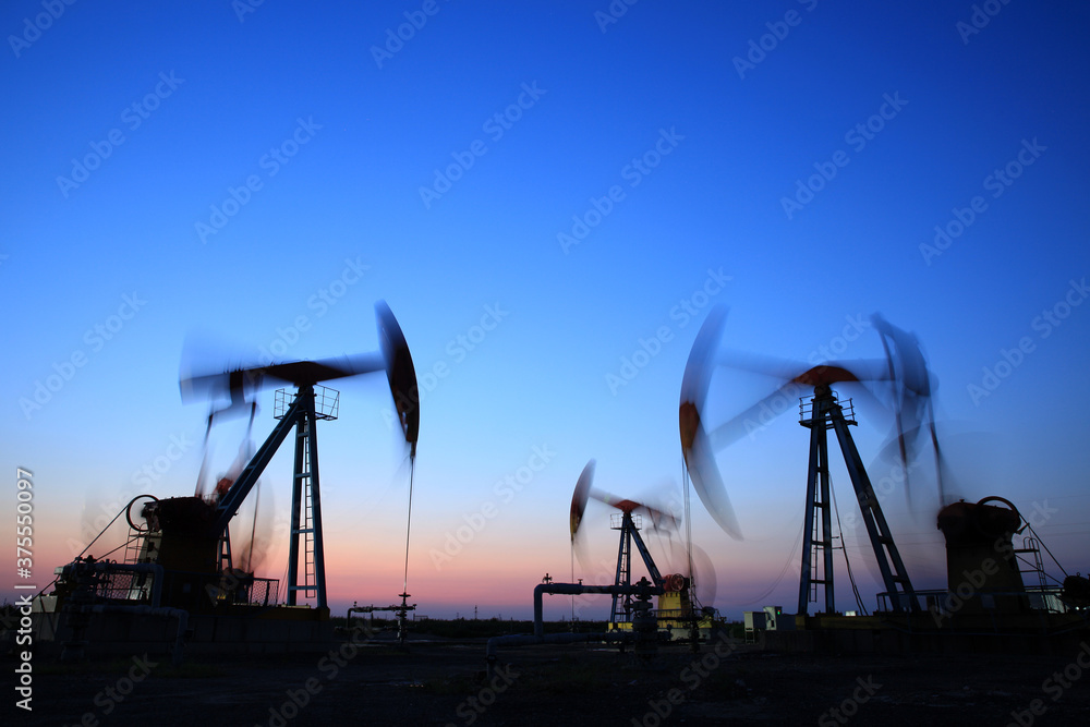 in the evening, oil pumps are running in the evening, oil pumps are running
