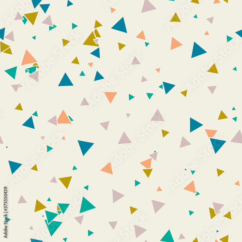 Abstract Memphis seamless pattern with colorful chaotic small triangles. Infinity triangular messy geometric pattern. Colorful Terrazzo tile. Vector illustration.