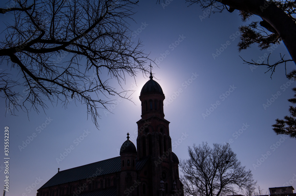 The Beautiful silhouette  Catholic church at sunset.