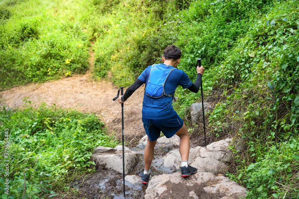 Runner, he's running a trail. In the mountain nature trail Runner, he's running a trail. In the mountain nature trail