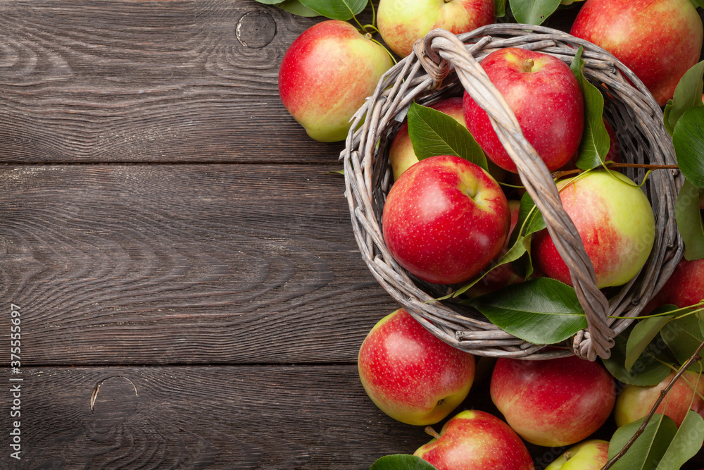 Ripe garden apple fruits in basket Ripe garden apple fruits in basket