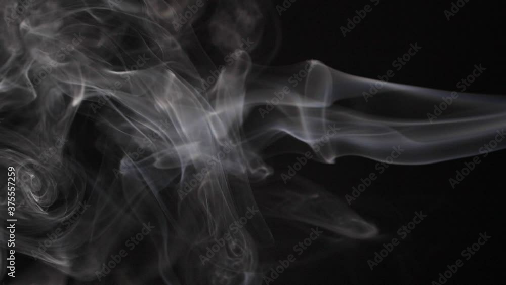 Slow motion of white abstract cigarette smoke on black background Slow motion of white abstract cigarette smoke on black background