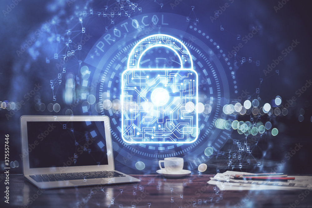 Double exposure of desktop with computer and lock icon hologram. Concept of data safety. Double exposure of desktop with computer and lock icon hologram. Concept of data safety.
