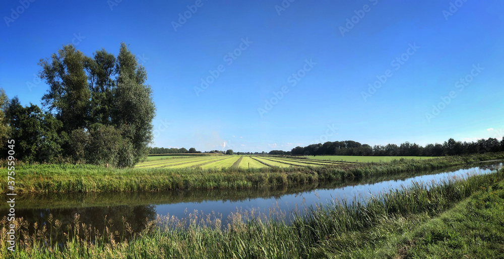 Landscape. meadows with canal. Havelte. Meenthe. Drenthe Netherlands. Panorama. Grasdrogerij Ruinerwold.