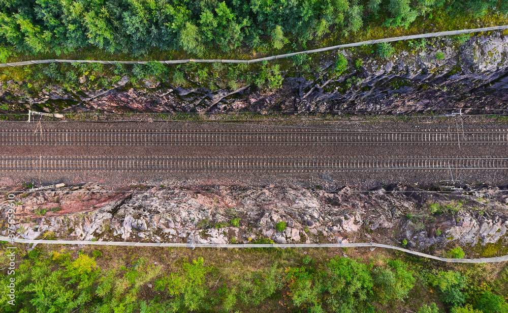 Aerial view of the railway track. The railroad between the hills.