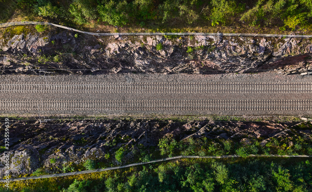 Aerial view of the railway track. The railroad between the hills.