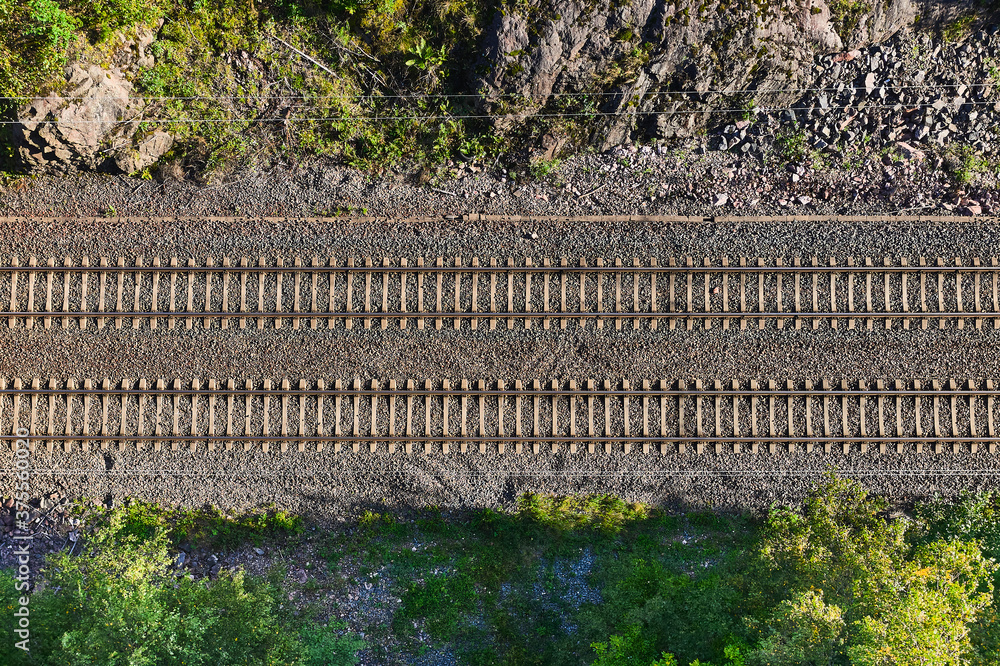 Aerial view of the railway track. The railroad between the hills.