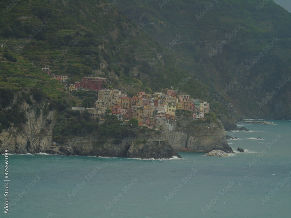 Cinque Terre, Italy - 08/31/2020: Beautiful landscape of a coastal fishing village, amazing view on many little colorful houses, traditional architecture of the little Italian town called Cinque Terre