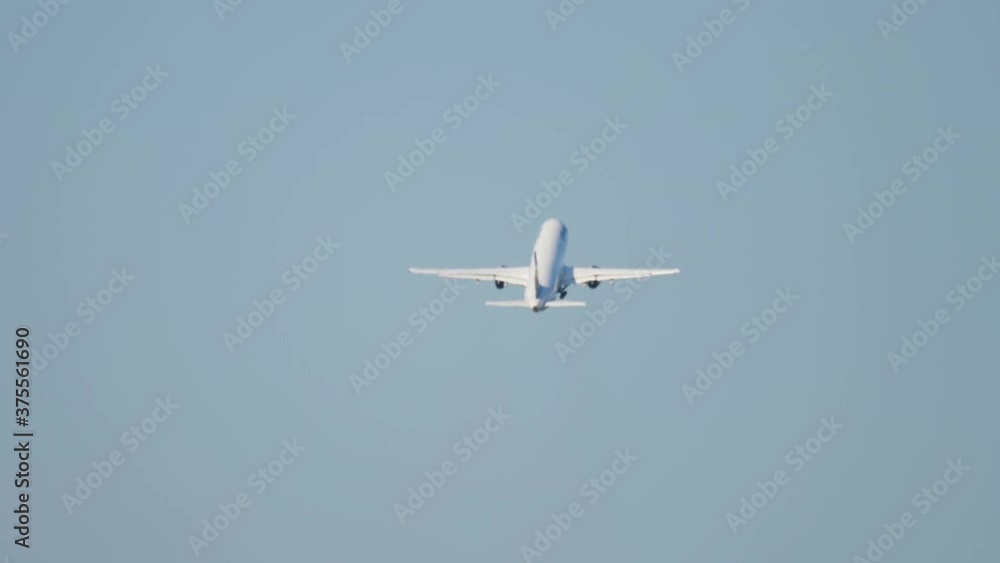 Airliner climbing in the air after take-off Airliner climbing in the air after take-off