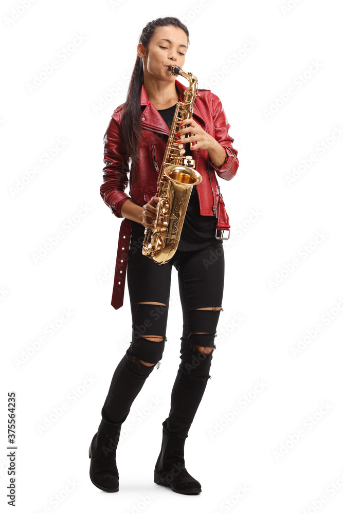Fototapeta premium Full length portrait of a female saxophonist in a red leather jacket playing sax