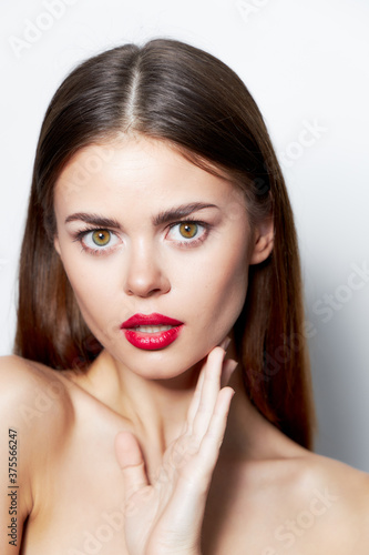 Lady skin care Charming look red lips hand near the lyceum 