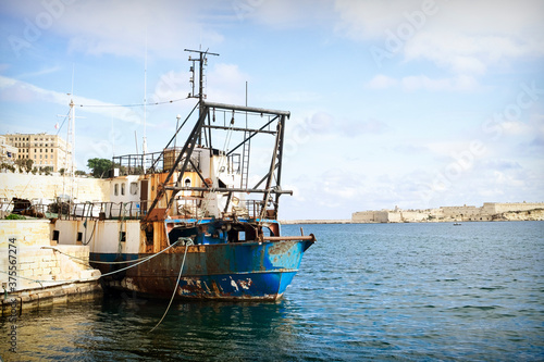 An old fishing ship in the Grand Harbor of Malta