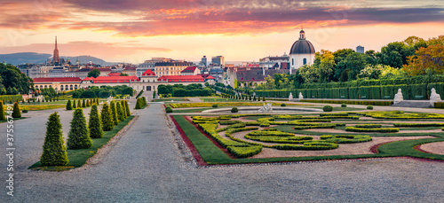 Panoramic spring view of Belvedere park, built by Johann Lukas von Hildebrandt for Prince Eugene of Savoy with Town Hall and Maria Heimsuchung Catholic church on background, Vienna, Austria, Europe.