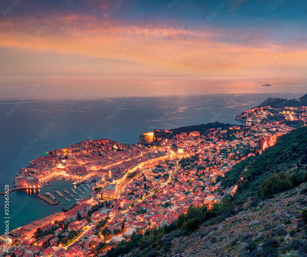 Fantastic evening view of Dubrovnik city. Colorful sunset in Croatia, Europe. Superb summer seascpae of Mediterranean sea. Traveling concept background.
