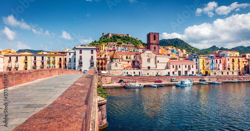 Colorful summer cityscape of Bosa town with Ponte Vecchio bridge across the Temo river. Amazing morning view of Sardinia island  Italy  Europe. Traveling concept background.
