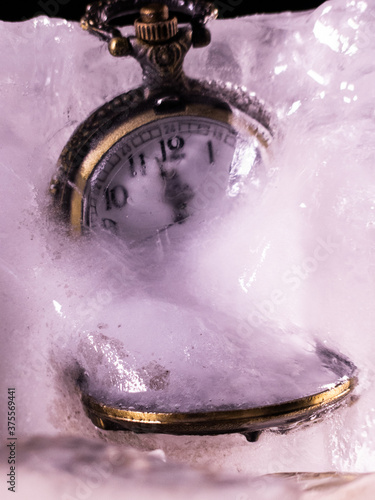 fob watch frozen in ice block frozen in time