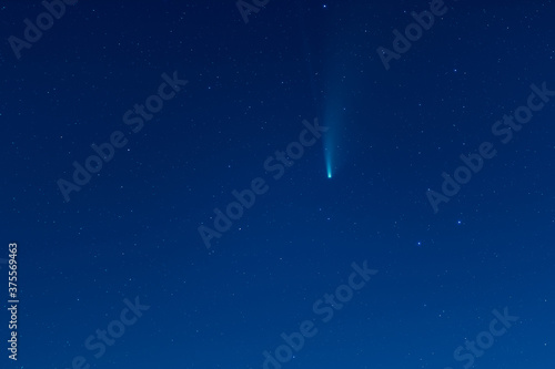 Beautiful dark night starry sky with real flying Neowise comet in 2020