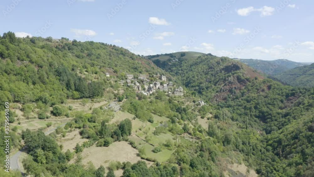 La Vinzelle, french picturesque mountain lush green countryside village aerial view rising dolly left La Vinzelle, french picturesque mountain lush green countryside village aerial view rising dolly left