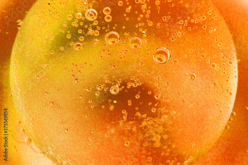 abstract light orange background with oil circles . oil bubbles of water close up. fiery circle bubbles background