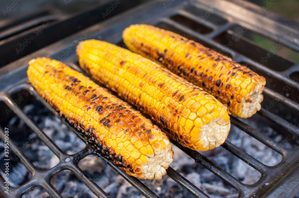 Ripe yellow corn is grilled. BBQ and grill Ripe yellow corn is grilled. BBQ and grill