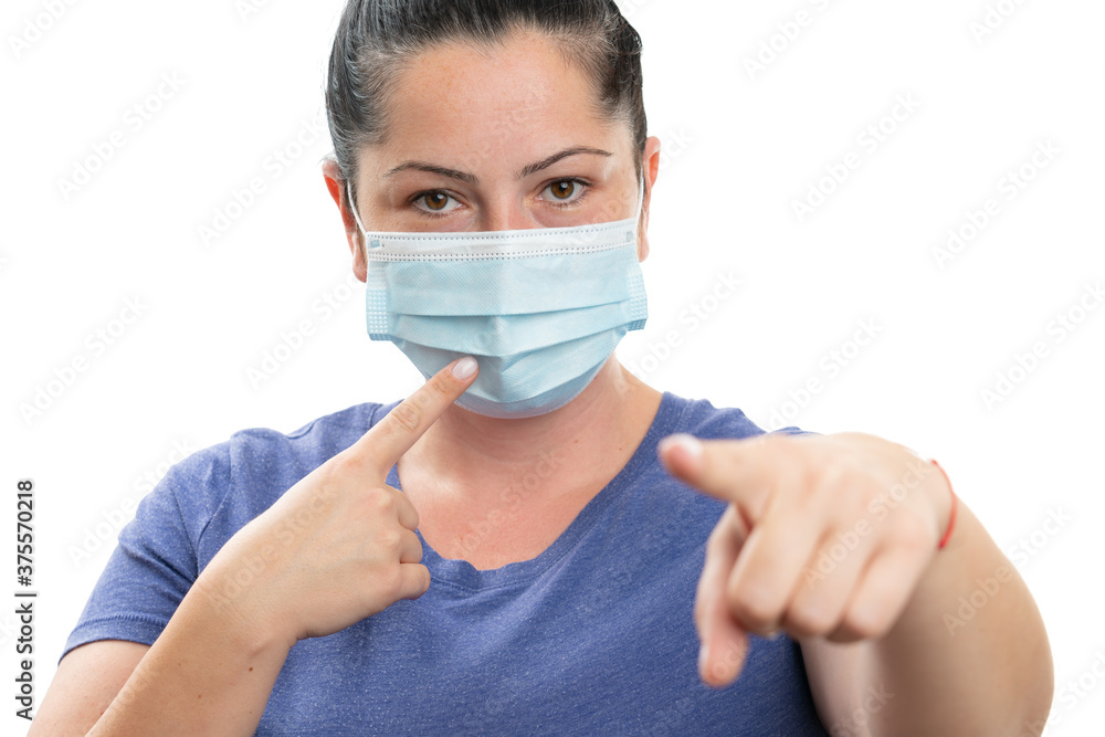 Female pointing fingers at medical or surgical mask and screen