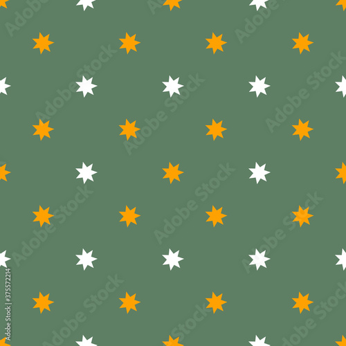 Seamless cute Halloween pattern with small orange white stars on earthy green background. Elegant holiday print for fabric textile gift paper scrapbook wallpaper kids crafts