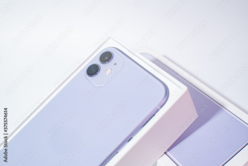 Purple smartphone with two cameras on a white background Purple smartphone with two cameras on a white background